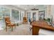 Bright sunroom with many windows and a ceiling fan for comfort at 1835 Redbourne Dr, Atlanta, GA 30350