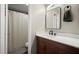 Clean bathroom with white countertop, dark cabinetry, and patterned shower curtain provides a refreshing space at 301 Parkaire Xing, Marietta, GA 30068