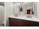 Modern bathroom boasts double sinks, dark wood cabinets, and framed mirrors for a clean, sophisticated look at 301 Parkaire Xing, Marietta, GA 30068