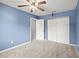 Spacious bedroom with neutral carpet and a ceiling fan at 301 Parkaire Xing, Marietta, GA 30068