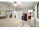 Bright main bedroom with ceiling fan, a large closet, and ensuite bathroom at 301 Parkaire Xing, Marietta, GA 30068