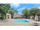 Inviting community pool surrounded by lounge chairs and umbrellas providing a perfect spot for relaxation at 301 Parkaire Xing, Marietta, GA 30068