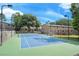 Well-maintained tennis court surrounded by lush greenery, offering recreational opportunities for residents at 301 Parkaire Xing, Marietta, GA 30068