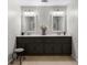 Elegant bathroom featuring dual vanities, framed mirrors, and plenty of storage space at 4875 Rivercliff Sw Trce, Lilburn, GA 30047