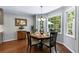 Inviting breakfast nook with large windows providing natural light and views of the surrounding landscape at 4875 Rivercliff Sw Trce, Lilburn, GA 30047