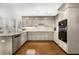 Bright kitchen with stainless steel appliances, modern cabinetry and granite countertops, perfect for cooking at 4875 Rivercliff Sw Trce, Lilburn, GA 30047
