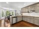 Well-lit kitchen with stainless steel appliances and view to back yard with a breakfast nook at 4875 Rivercliff Sw Trce, Lilburn, GA 30047