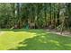Community playground surrounded by lush greenery at 4875 Rivercliff Sw Trce, Lilburn, GA 30047