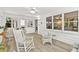 Bright and airy sunroom with lots of natural light and a relaxing sitting area with many large windows at 4875 Rivercliff Sw Trce, Lilburn, GA 30047