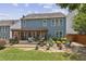 Spacious backyard featuring a patio, pergola, fire pit, and lush greenery, ideal for outdoor entertaining and relaxation at 606 Lorimore Pass, Canton, GA 30115