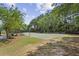 Outdoor basketball court with playground equipment, providing recreational space for sports and activities in a community setting at 606 Lorimore Pass, Canton, GA 30115