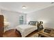 Comfortable bedroom with a bed, desk, and chair, offering a functional and inviting space with natural light at 606 Lorimore Pass, Canton, GA 30115