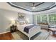 Relaxing bedroom with a plush bed, bedside tables, and natural light, promoting a peaceful retreat at 606 Lorimore Pass, Canton, GA 30115