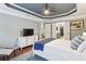Serene bedroom with a blue accent ceiling, a plush bed, and ample natural light, creating a tranquil retreat at 606 Lorimore Pass, Canton, GA 30115