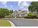 Exterior view of community clubhouse with manicured landscaping and beautiful architecture at 606 Lorimore Pass, Canton, GA 30115