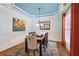 Formal dining room featuring beautiful blue tray ceiling and modern décor at 606 Lorimore Pass, Canton, GA 30115