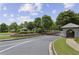 Neighborhood entrance with manicured landscaping and well maintained signage at 606 Lorimore Pass, Canton, GA 30115
