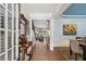 Elegant foyer showcasing hardwood floors, wainscoting, and views into the home's open living spaces at 606 Lorimore Pass, Canton, GA 30115