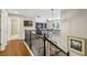 Spacious upper hallway with hardwood flooring and wrought iron railing, leading to various living areas at 606 Lorimore Pass, Canton, GA 30115