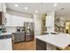 Well-appointed kitchen featuring granite countertops, stainless steel appliances, and ample cabinet space at 606 Lorimore Pass, Canton, GA 30115