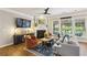 Comfortable living room with fireplace, built ins, and abundant natural light at 606 Lorimore Pass, Canton, GA 30115