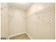 Spacious walk-in closet featuring built-in shelving and wood-look flooring provides ample storage at 1399 Cutters Mill Dr, Lithonia, GA 30058