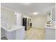 Well-lit kitchen showcasing stainless steel appliances, a breakfast bar, and ample counter space at 1399 Cutters Mill Dr, Lithonia, GA 30058