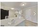 Eat in kitchen featuring modern appliances, an island with light countertops, and sleek cabinetry at 1399 Cutters Mill Dr, Lithonia, GA 30058