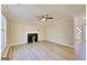 Cozy living room featuring a fireplace, wood-look flooring, and abundant natural light at 1399 Cutters Mill Dr, Lithonia, GA 30058