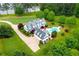 Aerial view of beautiful home, in-ground pool and well-manicured landscaping in a private setting at 1415 N Flat Rock Rd, Douglasville, GA 30134