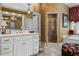 Bathroom featuring a white vanity with double sinks and a separate glass shower at 1415 N Flat Rock Rd, Douglasville, GA 30134