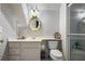 Cozy bathroom featuring decorative wallpaper, vanity, and toilet with shower at 1415 N Flat Rock Rd, Douglasville, GA 30134