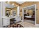 Bright bathroom with white vanity and natural light leading to bedroom at 1415 N Flat Rock Rd, Douglasville, GA 30134