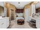 Luxurious bathroom features a soaking tub, vanity with seating, and separate shower at 1415 N Flat Rock Rd, Douglasville, GA 30134