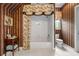 Stylish bathroom with decorative wallpaper, shower with curtain, and vanity at 1415 N Flat Rock Rd, Douglasville, GA 30134
