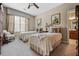 Charming bedroom featuring twin beds with neutral decor and an abundance of natural light at 1415 N Flat Rock Rd, Douglasville, GA 30134