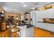 Well-lit kitchen featuring white cabinets, black countertops, and a breakfast bar at 1415 N Flat Rock Rd, Douglasville, GA 30134