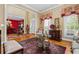 Inviting living room with hardwood floors, decorative rug, and access to the dining room at 1415 N Flat Rock Rd, Douglasville, GA 30134