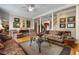Bright living room with hardwood floors, lots of light, and traditional furnishings at 1415 N Flat Rock Rd, Douglasville, GA 30134