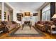 Cozy living room showcasing a fireplace, built-in shelving, and hardwood floors at 1415 N Flat Rock Rd, Douglasville, GA 30134