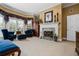 Inviting main bedroom with fireplace, sitting area, and access to backyard at 1415 N Flat Rock Rd, Douglasville, GA 30134