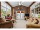 Spacious sunroom with vaulted ceilings, lots of windows, and access to the backyard at 1415 N Flat Rock Rd, Douglasville, GA 30134