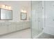 Bright bathroom with a double vanity, stone countertops, and a glass-enclosed shower at 385 Rowes Cir, Alpharetta, GA 30009