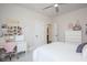 Bright, clean bedroom with a white bed, desk, and accents, creating a peaceful and stylish retreat at 385 Rowes Cir, Alpharetta, GA 30009