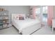 Bright bedroom with natural light, white furniture, and decorative touches creating a charming space at 385 Rowes Cir, Alpharetta, GA 30009