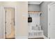 Well-organized entryway with built-in storage bench, hooks, and decorative accents for a welcoming space at 385 Rowes Cir, Alpharetta, GA 30009
