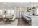 Bright, open kitchen with a large island, stainless steel appliances, and ample counter space at 385 Rowes Cir, Alpharetta, GA 30009