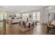 Expansive living area features hardwood floors, large windows, and an open dining and kitchen area at 385 Rowes Cir, Alpharetta, GA 30009