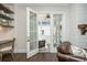 Office space with built-in shelves, a workspace, and access to a covered patio at 385 Rowes Cir, Alpharetta, GA 30009