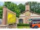 Charming retail shop 'Alpharetta Outfitters' with a stone chimney, sign, and an orange Jeep parked outside at 385 Rowes Cir, Alpharetta, GA 30009